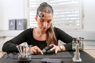 Swiss watchmaker assembling a COVER watch by hand – symbol of authentic Swiss Made craftsmanship and precision.