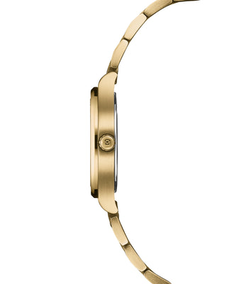 Side view showing the Altea’s curved gold case and green dial