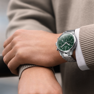Man wearing the COVER Chapman Chronograph watch with green dial – a refined Swiss Made timepiece from the COVER Gift Guide for Men.